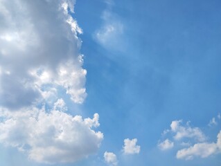 Dramatic clear blue sky view with sun shining behind 