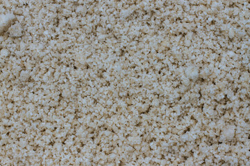 Pyramids of sea salt ready to be harvested in a salt farm at sunrise. Used as a seasoning in food,...
