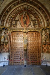 Wooden Gothic door with Christ and Virgin at Catedral de Leon