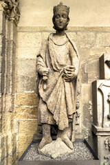 Stone sculpture of King David with crown and scroll in Leon Cathedral