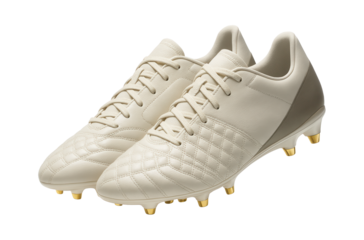 Soccer cleats with gold accents and embossed texture on the vamp