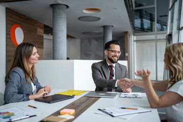 Business people shaking hands during a meeting in the office