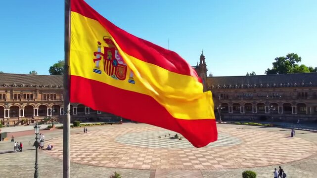 Spanish flag waving over a plaza