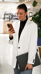 Stylish female professional ready for work discussion, remote collaboration, or client presentation in a cozy coffee shop setting