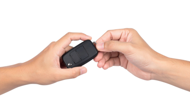 Two hands exchanging a black car key fob with buttons for locking and unlocking the car.