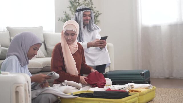 Muslim family preparing luggage for travel trip packing clothes into suitcase for international, holiday lifestyle vacation, halal trip planning, muslim tourism agency, muslim airline, ramadan journey