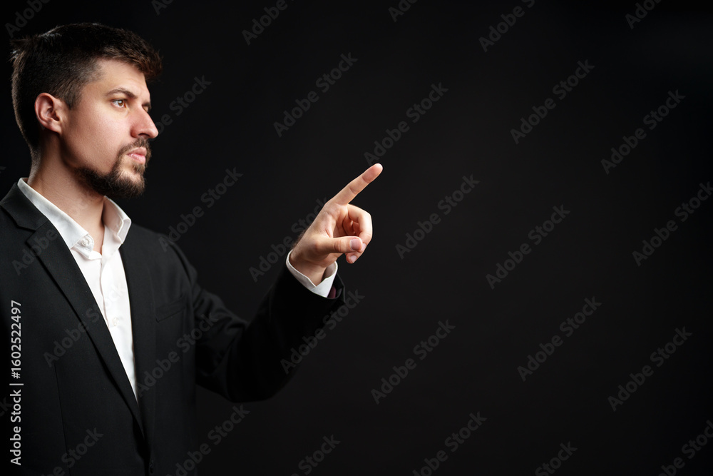 Poster business professional gestures confidently while presenting an idea in a formal setting against a da