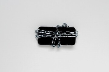 Smartphone Secured with Heavy Chains for Enhanced Protection