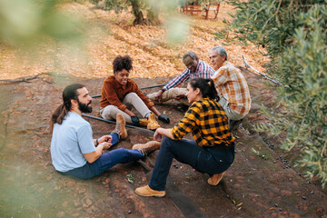 Farmers taking a break during olive harvest in orchard