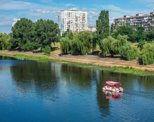 Pedal boat navigating the Dnipro river in Kyiv, Ukraine