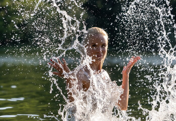 Woman in White Dress Playing with Water Splash Outdoors