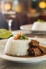 White rice with beef rendang close up background