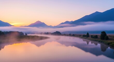 River Sunset. A wide river reflects the colors of the setting sun. The sky is a gradient of pink, purple, and orange. Mountains are visible in the distance with banks of fog.