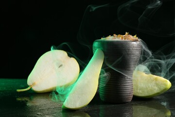 Hookah bowl with pear pieces and smoke on black table, closeup