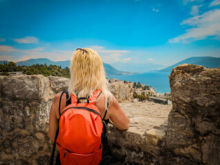 girl on the top of the tower oking to sea
