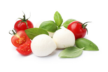 Tasty mozzarella cheese balls, tomatoes and basil isolated on white