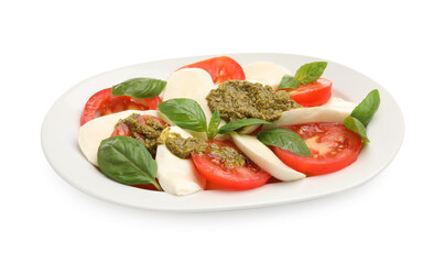 Tasty salad Caprese with mozzarella, tomatoes, basil and pesto sauce isolated on white