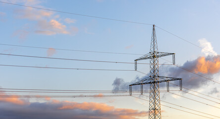 High-voltage line. Sunset and electricity. Modern design