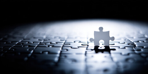 Single puzzle piece stands out in dark setting, symbolizing connection and completion