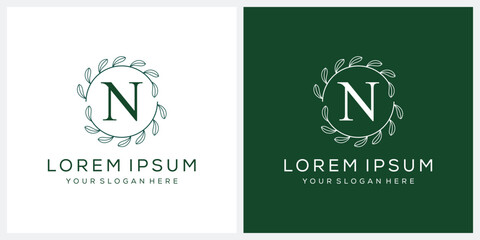 Initial letter N cosmetic spa and fashion logo design, serif font symbol icon, green leaf organic graphic vector