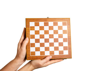 chessboard in female hand on light background