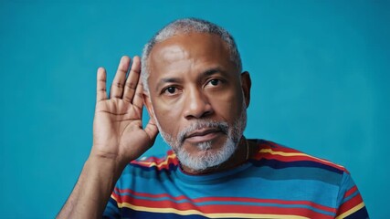 Portrait of middle-aged man with ear discomfort and hearing issue
