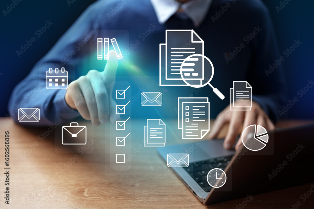 Aufkleber digital workspace with a man interacting with virtual icons on a laptop during a productive session