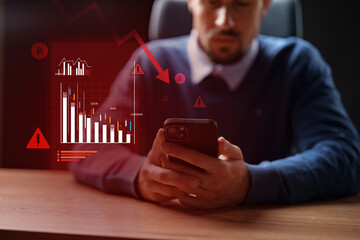 Man analyzing cryptocurrency market trends on mobile device during a period of financial downturn