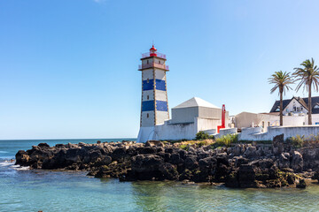 Coastal Lighthouse with Blue Stripes