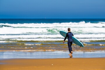Surfer on Contis beach, Saint Julien en Born , Saint-Julien-en-Born, Landes, France, Europe