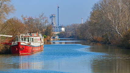 Red Boat Moored at Navigation Canal Arlles Fos Water Way in France