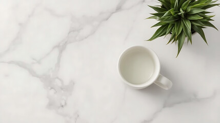 A minimalistic white ceramic mug on a marble surface with grey veining, a green leafy plant in the top right corner, clean lighting, and empty space on the left side.