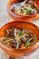 cumin spiced meatballs with shredded cabbage