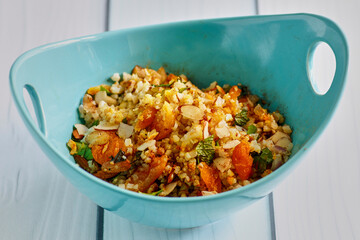 middle eastern cauliflower rice salad with almonds, dried fruit, and fresh herbs