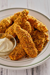 pistachio nut crusted chicken tenders with a curry mayo dipping sauce