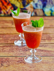 blended smoothie with fresh watermelon and basil leaves