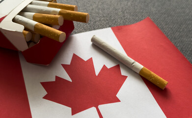 Canadian flag with cigarette on black background