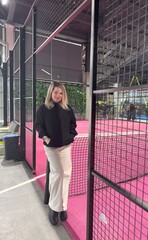 Woman in a padel court indoor 