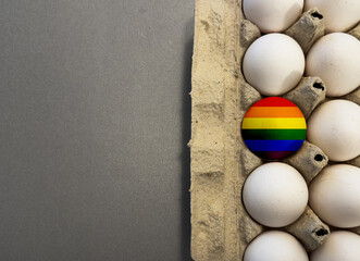 Colorful easter egg painted in rainbow colors of happiness or a flag of LGBTQ gays and lesbians.