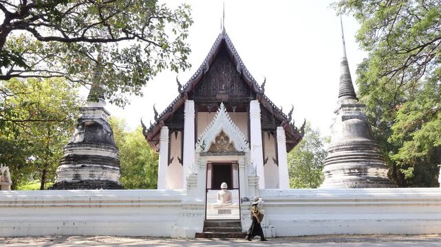Footage of a Female Visitor Appreciating Wat Thammaram Medieval Buddhist Temple from the Outside, Ayutthaya Historical Park, Thailand