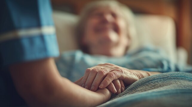 Caring nurse gently holds the hand of a smiling senior patient in a warm, comforting environment.