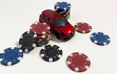 pile of casino chips and toy car