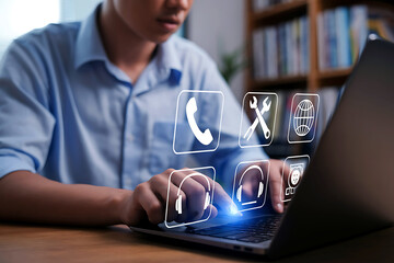 Man using laptop with digital service icons floating above keyboard