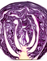 Obraz premium Cross section of red cabbage showing intricate patterns and purple hues