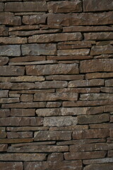 stacked natural brown stone wall, seamless pattern for background design