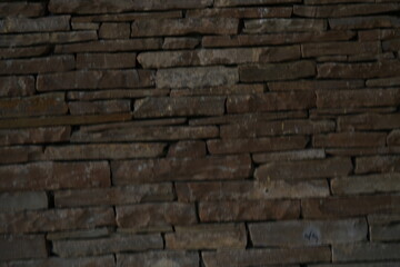 stacked natural brown stone wall, seamless pattern for background design