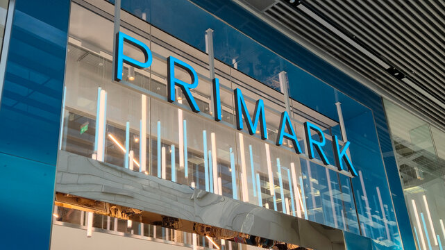 London UK - 07.01.2025 Primark store front with large blue letters mounted on glass facade, modern retail branding with vertical light tubes and stylish architectural details