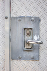 Fortified door handle and lock on steel door