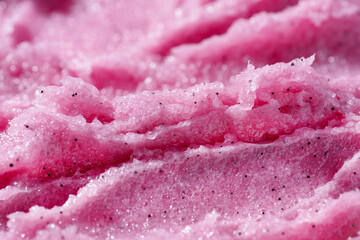 Raspberry fruit scrub texture. Bright pink creamy smear with exfoliating crystals. Organic cosmetic...
