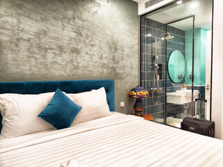 Stylish modern hotel room with comfortable bed and unique bathroom design in a vibrant city